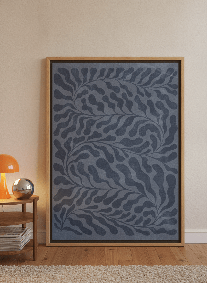Oversized statement canvas wall art with a natural timber surround leaning against the wall in a retro 70s bedroom