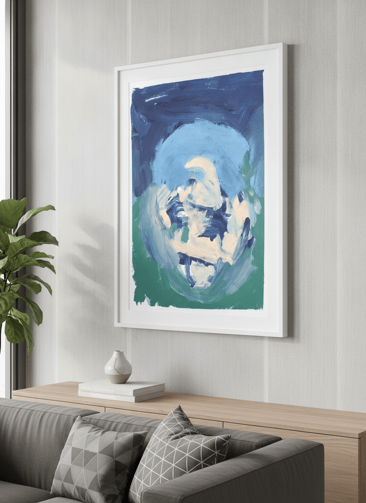 Modern wall art styled above a sofa in a neutral living room