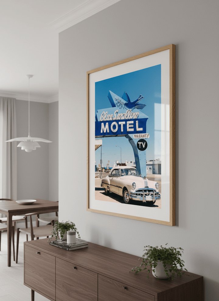 Wall art styled above a dining table in a contemporary home