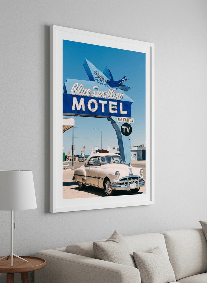 Modern wall art styled above a sofa in a neutral living room