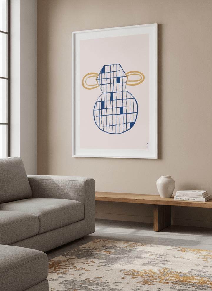 Modern wall art styled above a sofa in a neutral living room