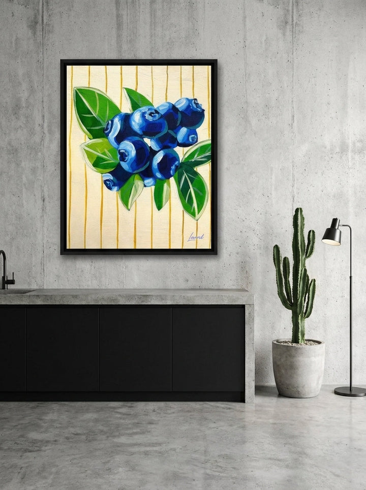 Canvas wall art with a black surround styled on the wall in an industrial loft kitchen
