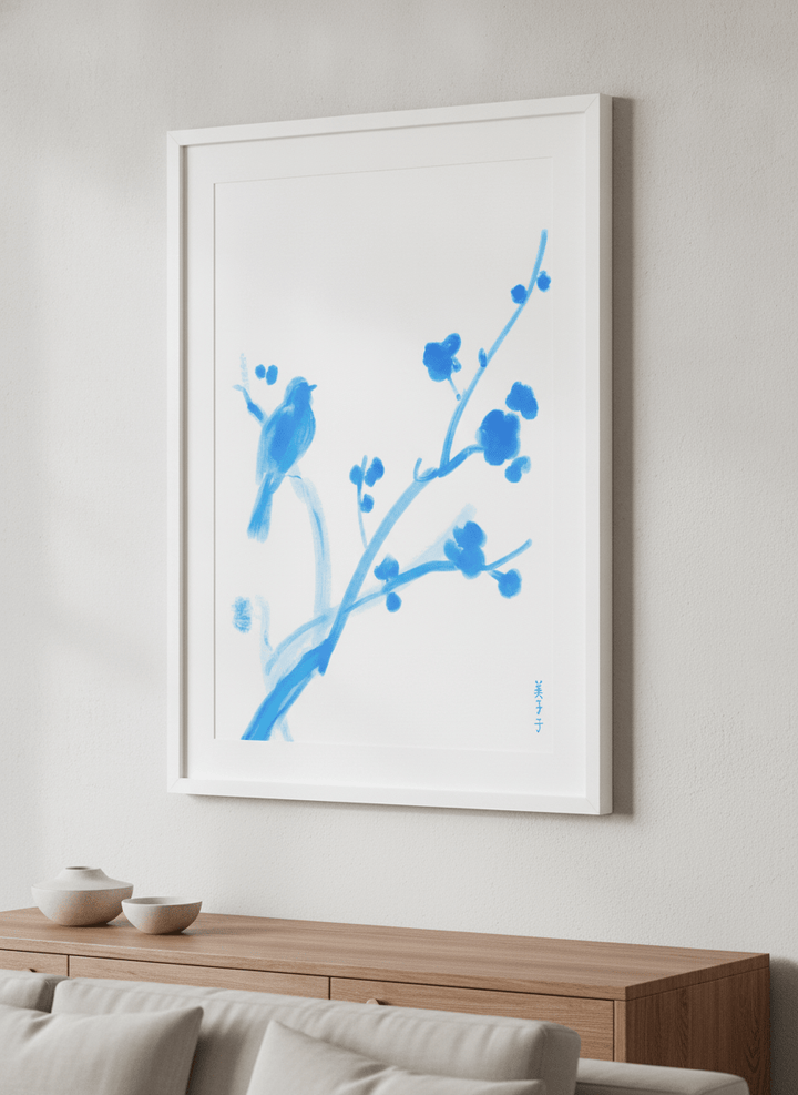 Modern wall art styled above a sofa in a neutral living room