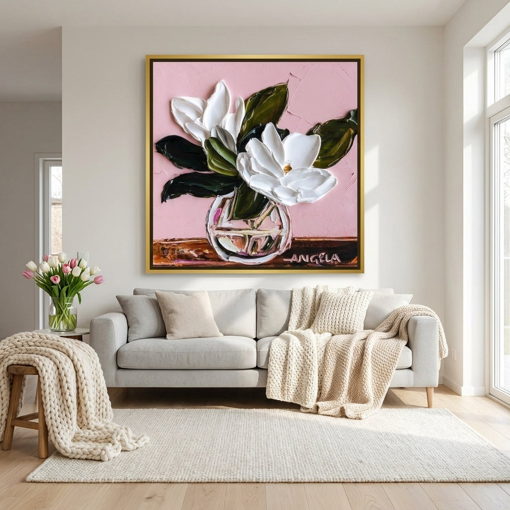 Oversized statement canvas wall art with a gold leaf surround styled on the wall in a bright Scandinavian living room