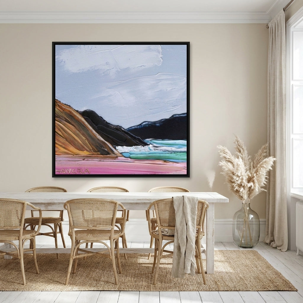 Oversized statement canvas wall art with a black surround styled on the wall in a coastal dining room