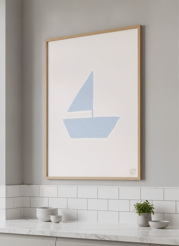 Artwork styled on the wall of a bright modern kitchen