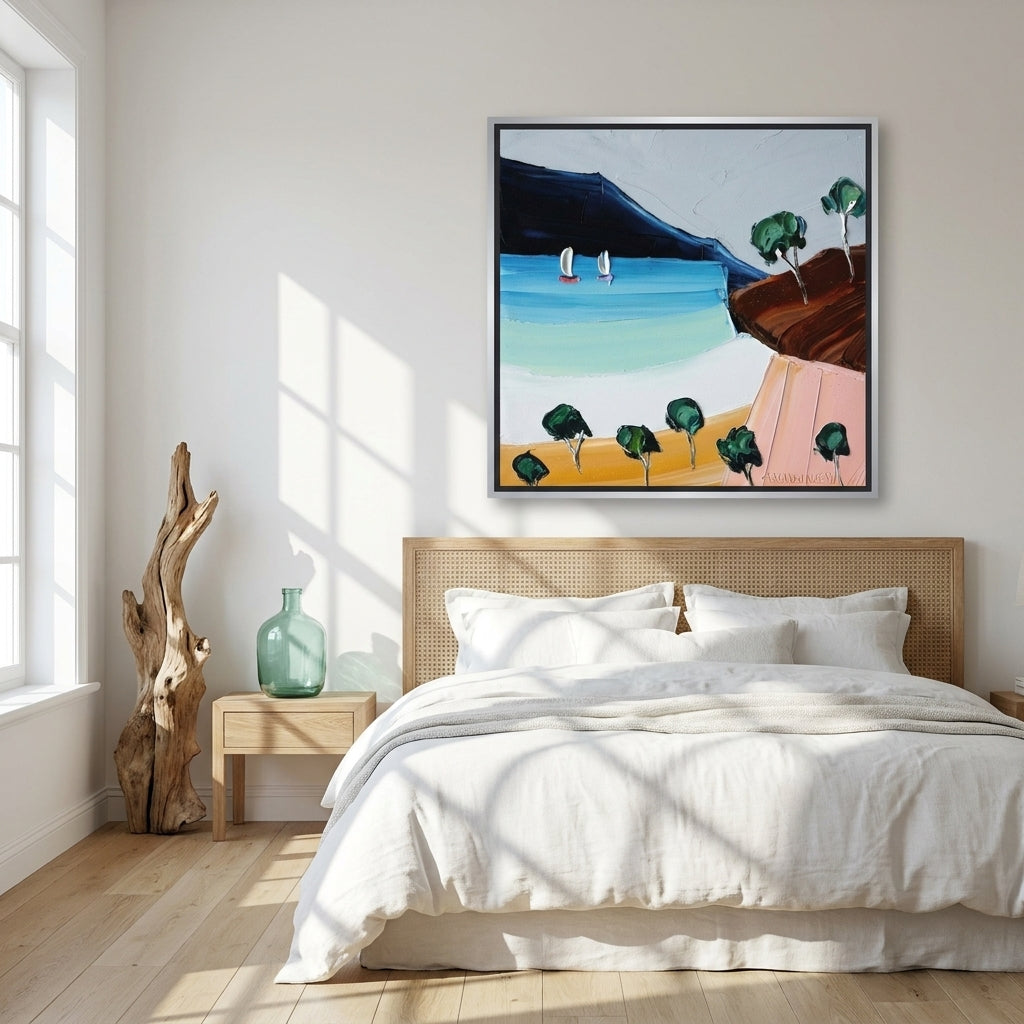 Oversized statement canvas wall art with a silver leaf surround styled on the wall in a coastal bedroom