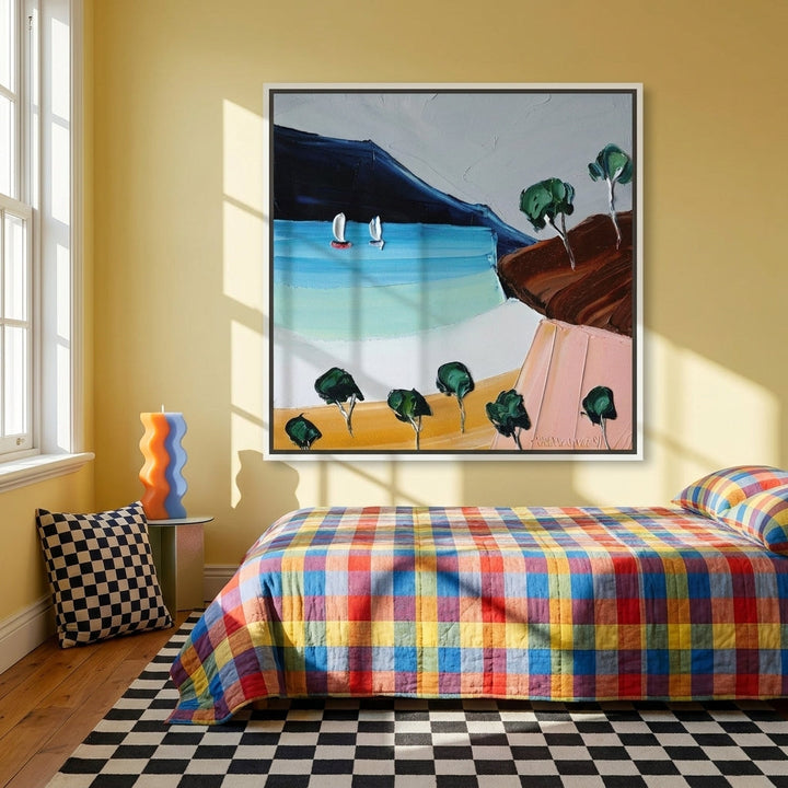 Canvas wall art with a white surround styled on the wall in a colourful eclectic bedroom