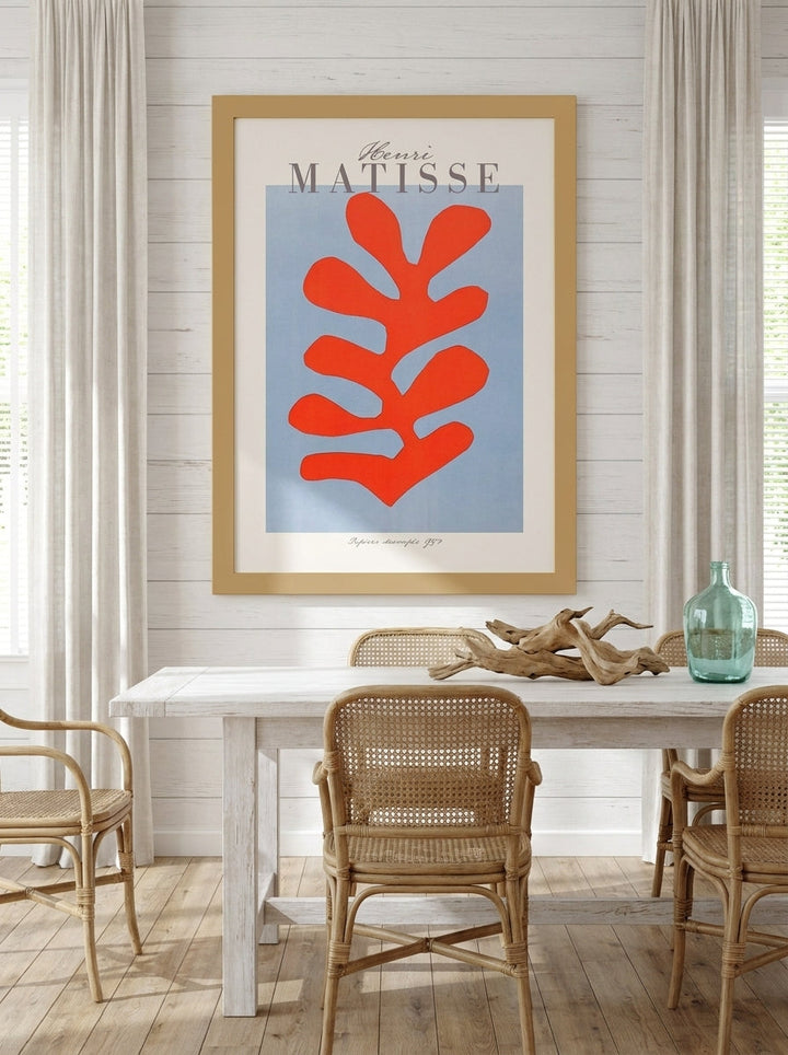 Oversized statement modern wall art print styled on the wall in a coastal dining room