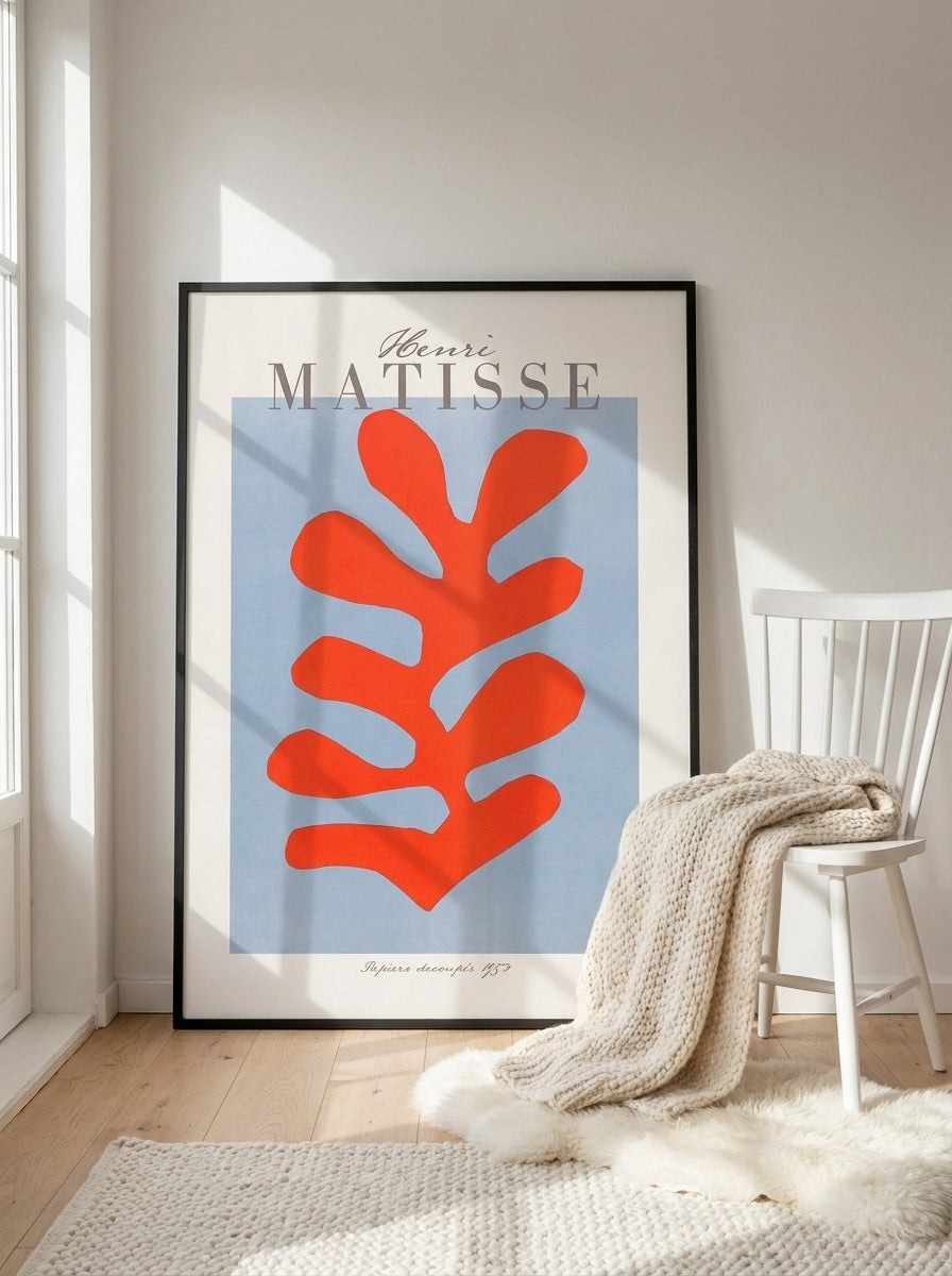 Oversized statement modern wall art print leaning against the wall in a bright Scandinavian bedroom