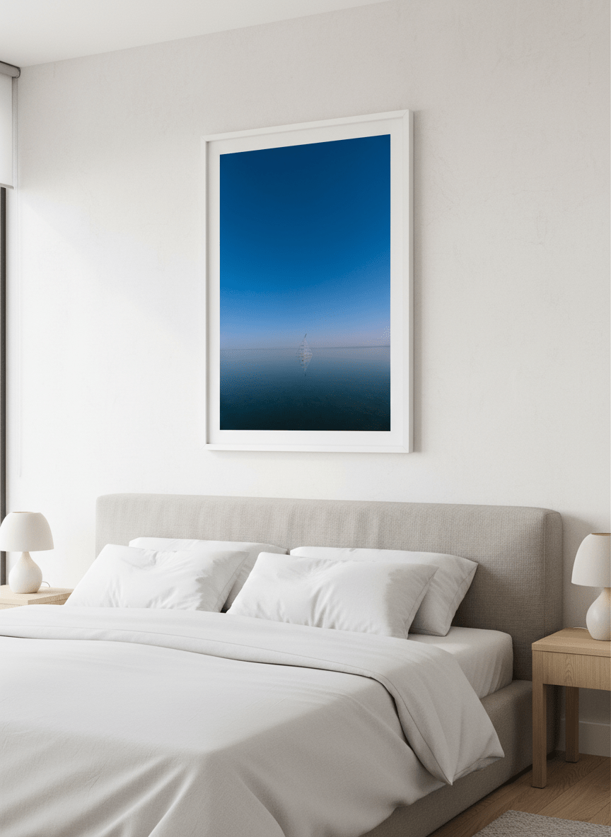 Minimalist artwork displayed in a calm, light-filled bedroom interior