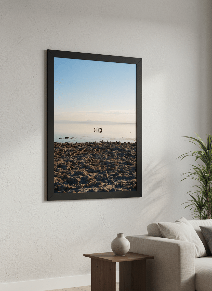 Modern wall art styled above a sofa in a neutral living room