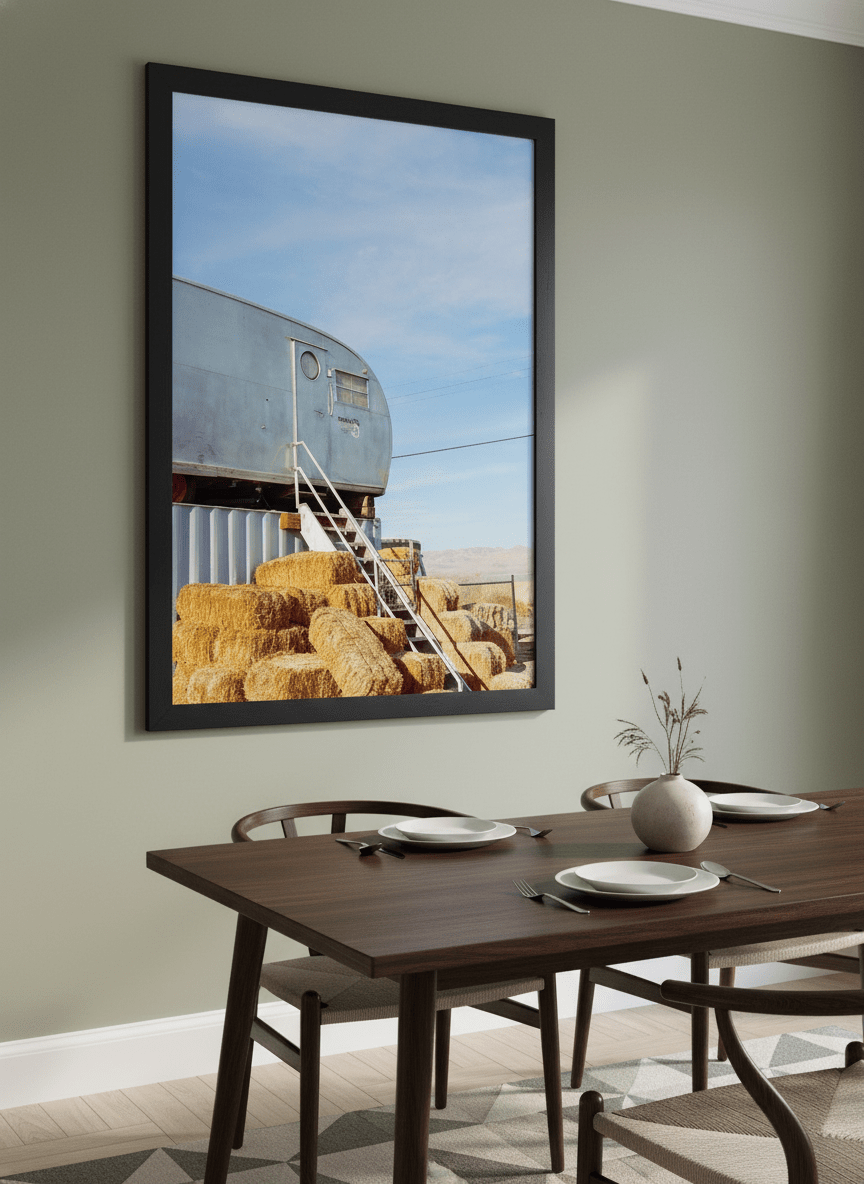 Wall art styled above a dining table in a contemporary home