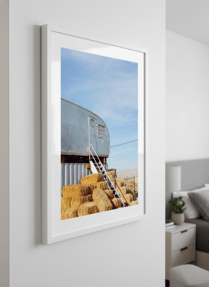 Minimalist artwork displayed in a calm, light-filled bedroom interior