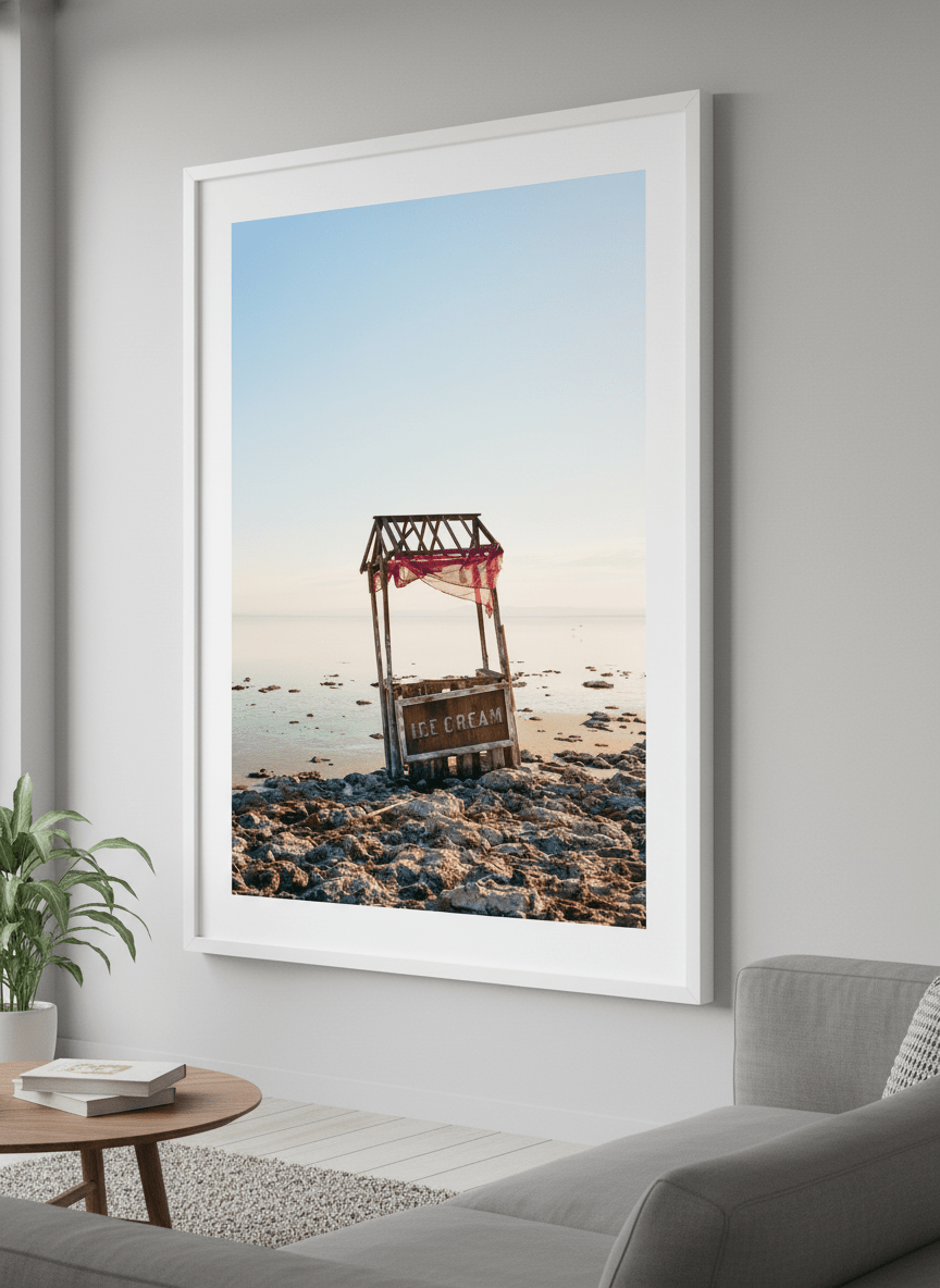 Modern wall art styled above a sofa in a neutral living room