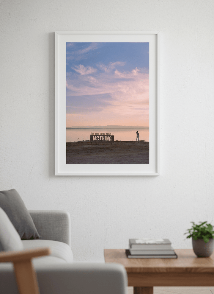 Modern wall art styled above a sofa in a neutral living room