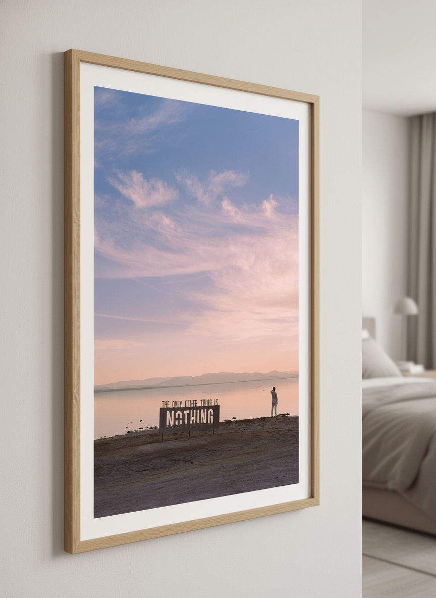 Minimalist artwork displayed in a calm, light-filled bedroom interior