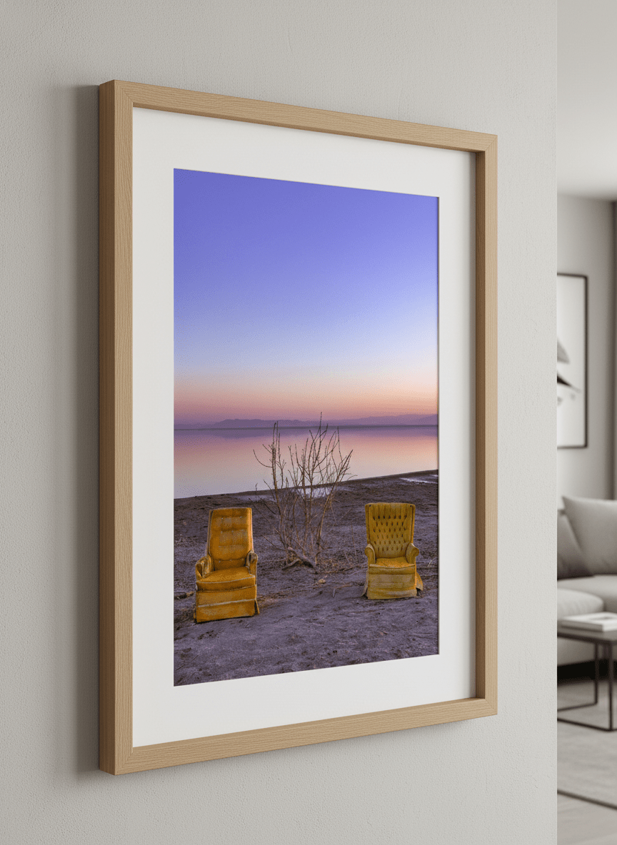 Modern wall art styled above a sofa in a neutral living room