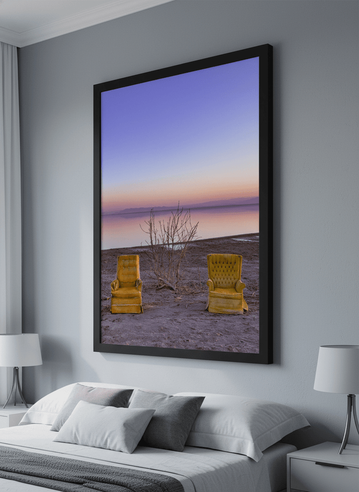 Minimalist artwork displayed in a calm, light-filled bedroom interior