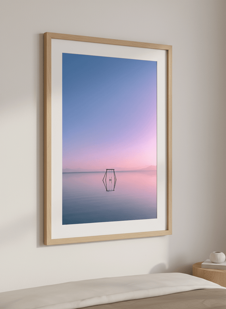 Minimalist artwork displayed in a calm, light-filled bedroom interior