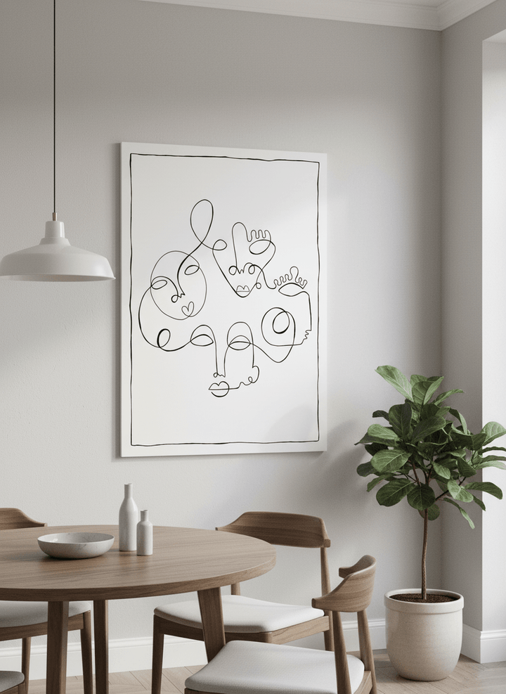 Wall art styled above a dining table in a contemporary home