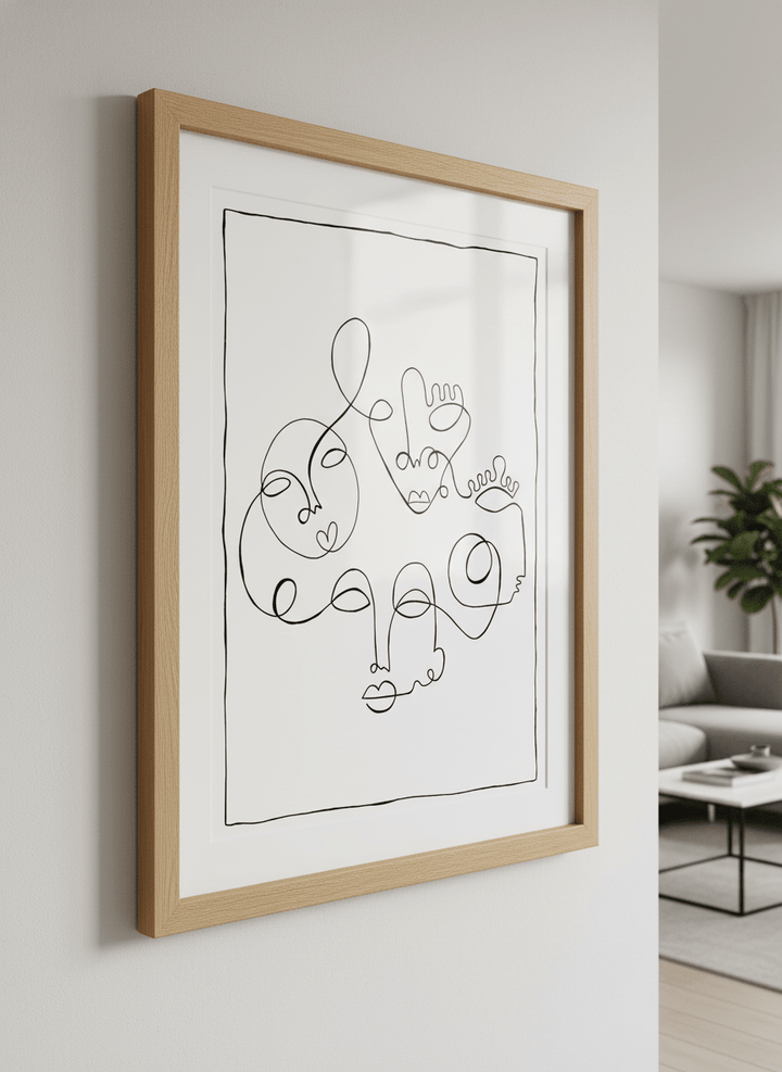 Modern wall art styled above a sofa in a neutral living room