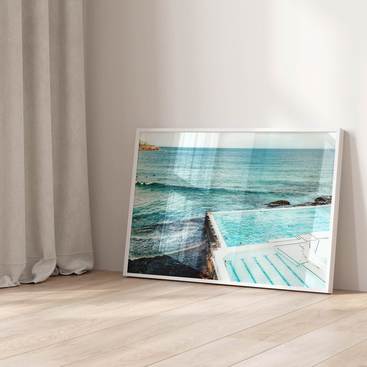 artwork of a pool and ocean scene on a wooden floor with curtains in the background
