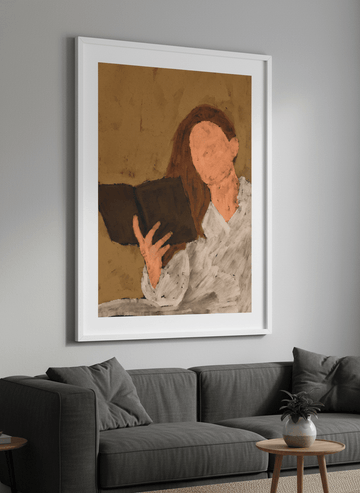 Modern wall art styled above a sofa in a neutral living room