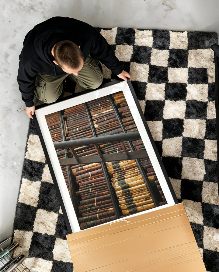 Person arranging vintage letterpress type on a checkered rug