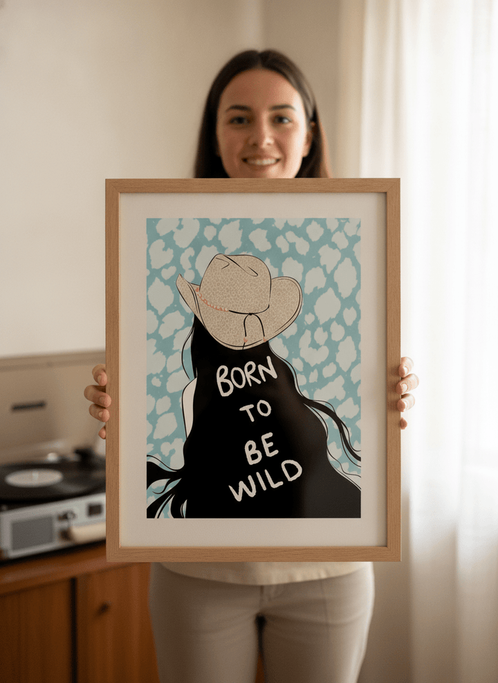 Person holding modern wall art print in a mid-century living room