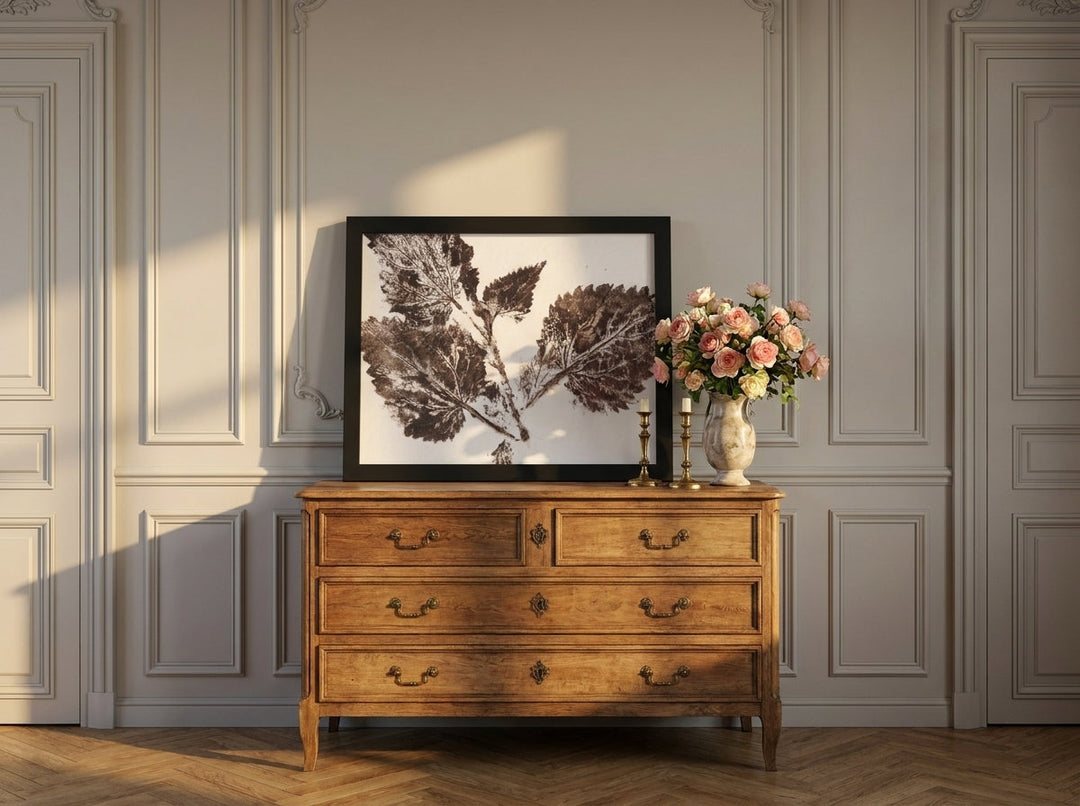 Modern wall art print standing on a sideboard in a Parisian bathroom