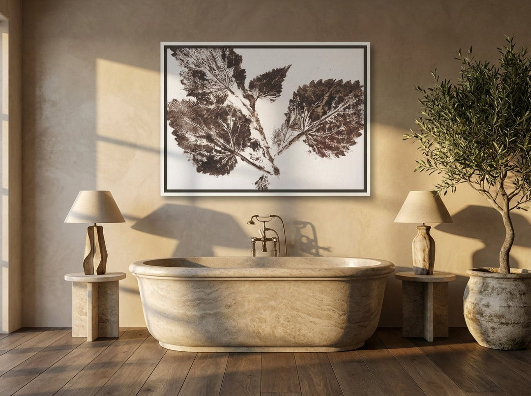 Canvas wall art with a white surround styled on the wall in a luxe bathroom