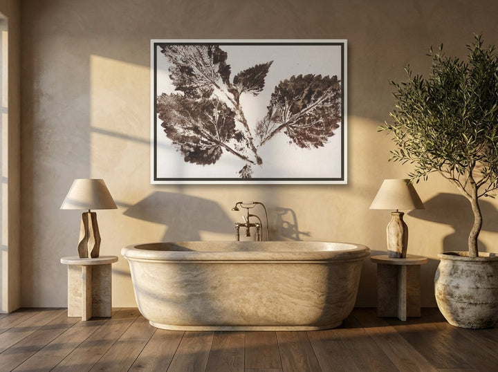 Canvas wall art with a white surround styled on the wall in a luxe bathroom
