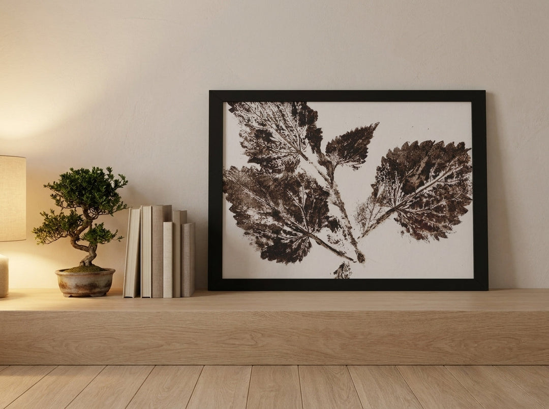 Modern wall art print standing on a shelf in a warm Japandi bedroom