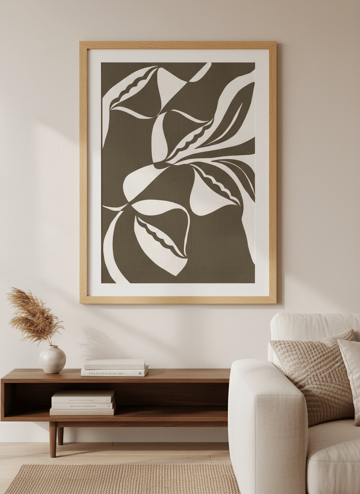 Modern wall art styled above a sofa in a neutral living room