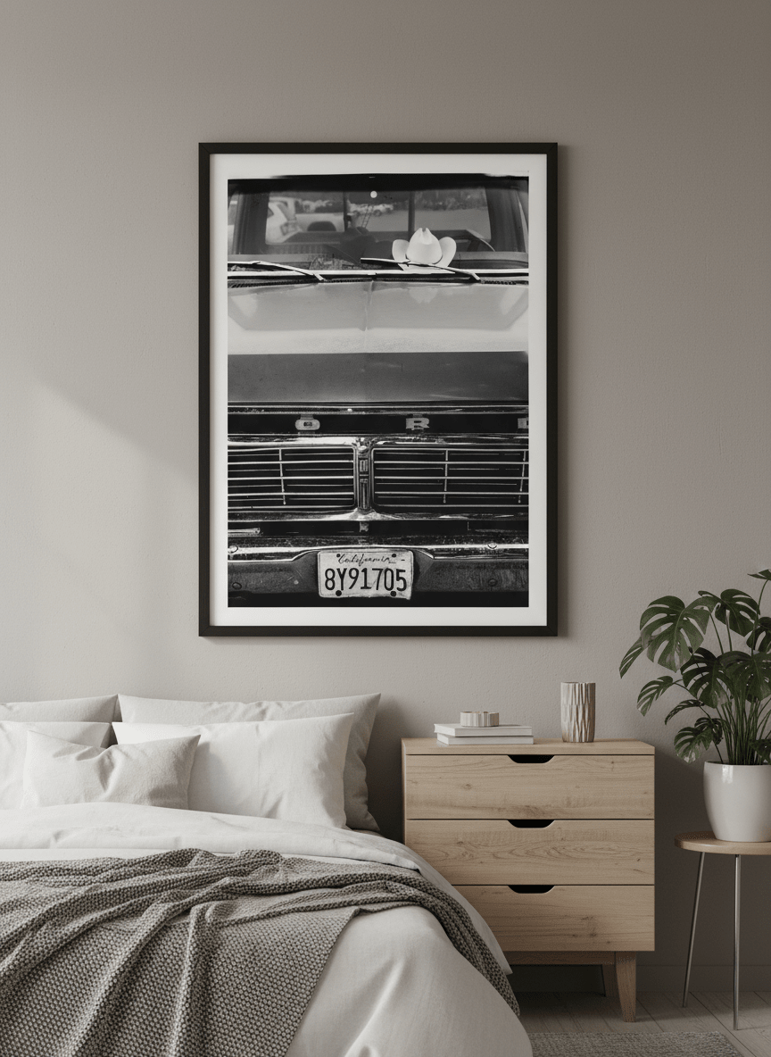 Minimalist artwork displayed in a calm, light-filled bedroom interior