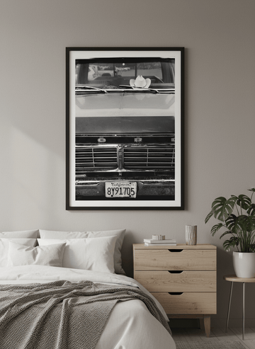 Minimalist artwork displayed in a calm, light-filled bedroom interior