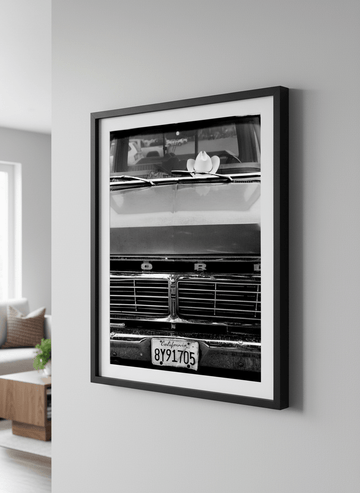 Modern wall art styled above a sofa in a neutral living room