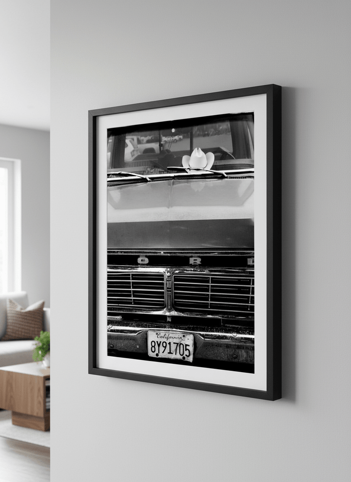 Modern wall art styled above a sofa in a neutral living room