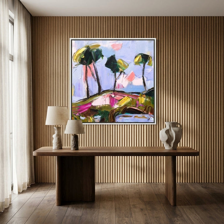 Canvas wall art with a white surround styled on the wall in a luxe home office