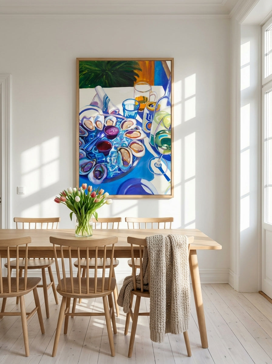 Modern wall art print styled on the wall in a bright Scandinavian dining room