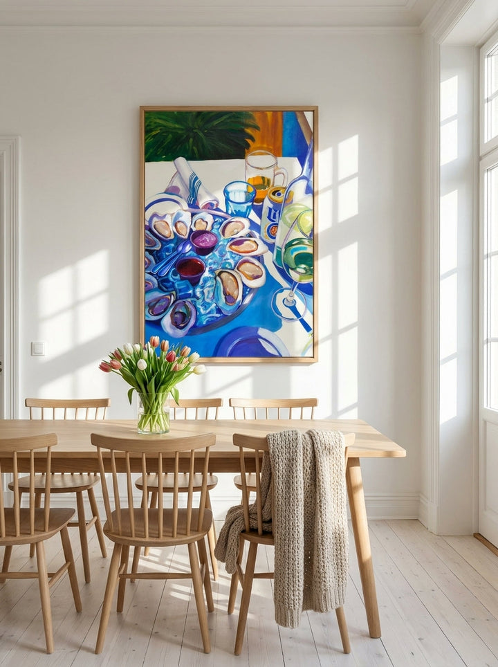 Modern wall art print styled on the wall in a bright Scandinavian dining room