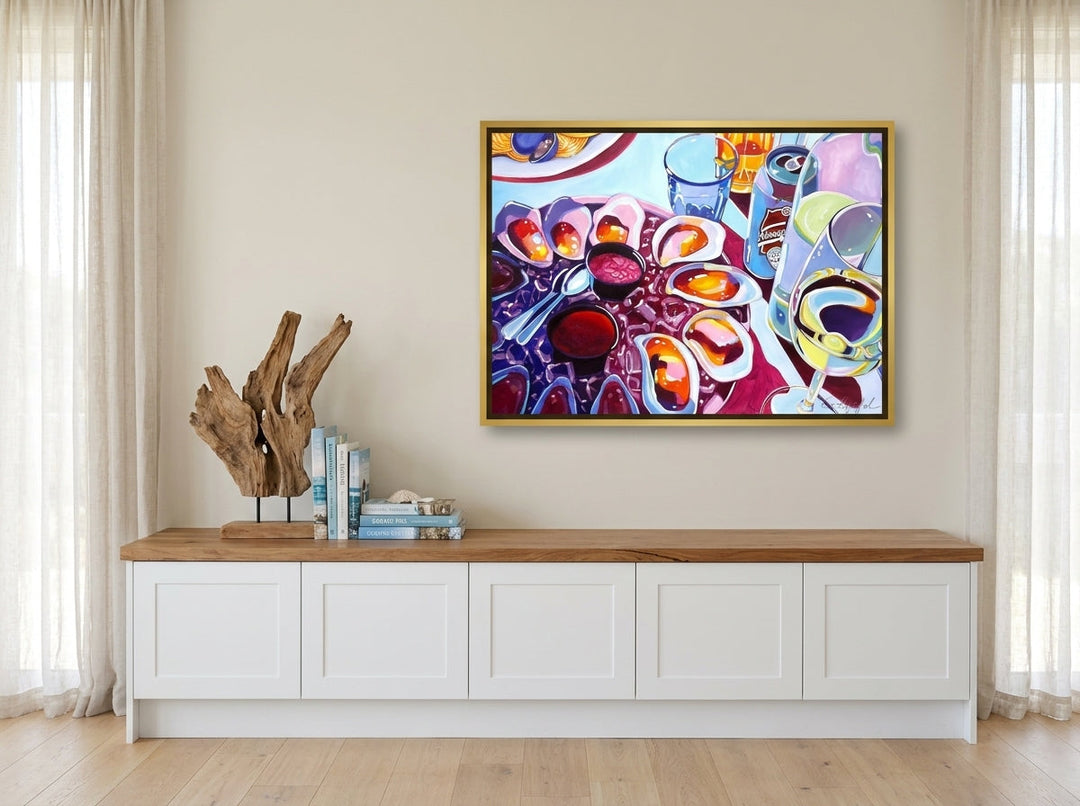 Canvas wall art with a gold leaf surround styled on the wall in a coastal kitchen