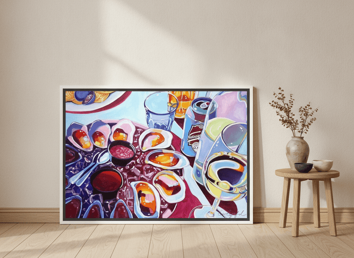 Canvas wall art with a white surround leaning against the wall in a warm Japandi dining room