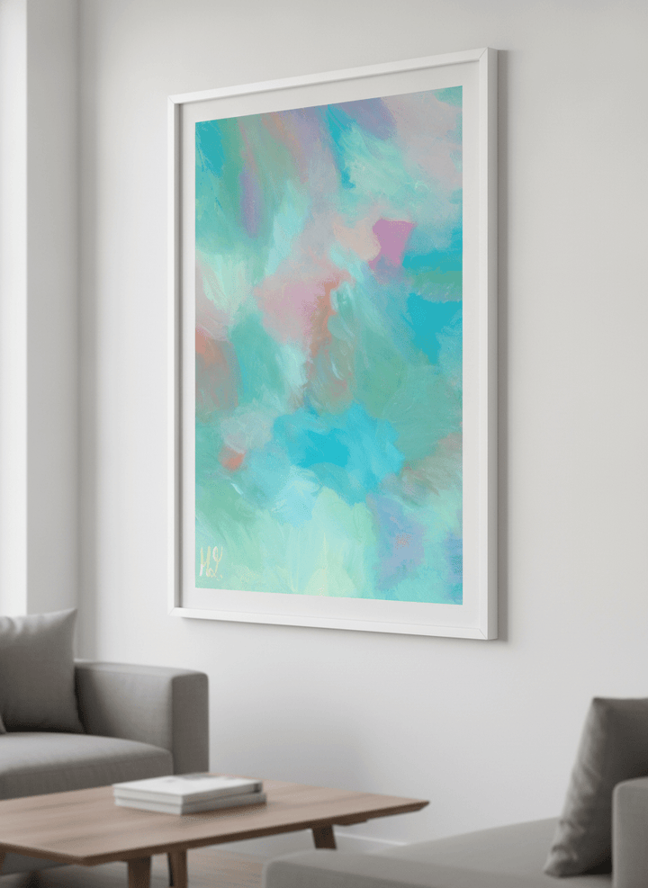 Modern wall art styled above a sofa in a neutral living room