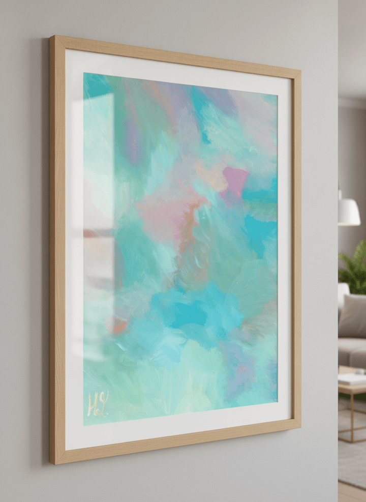 Modern wall art styled above a sofa in a neutral living room