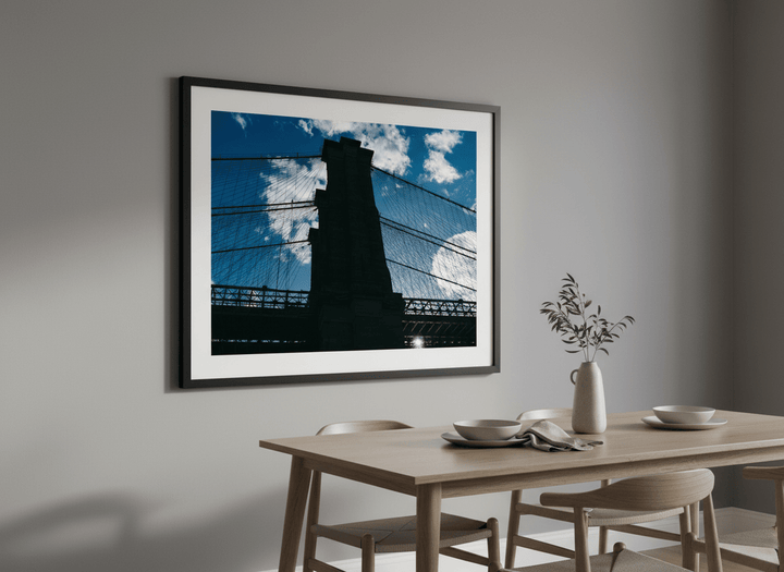 Wall art styled above a dining table in a contemporary home