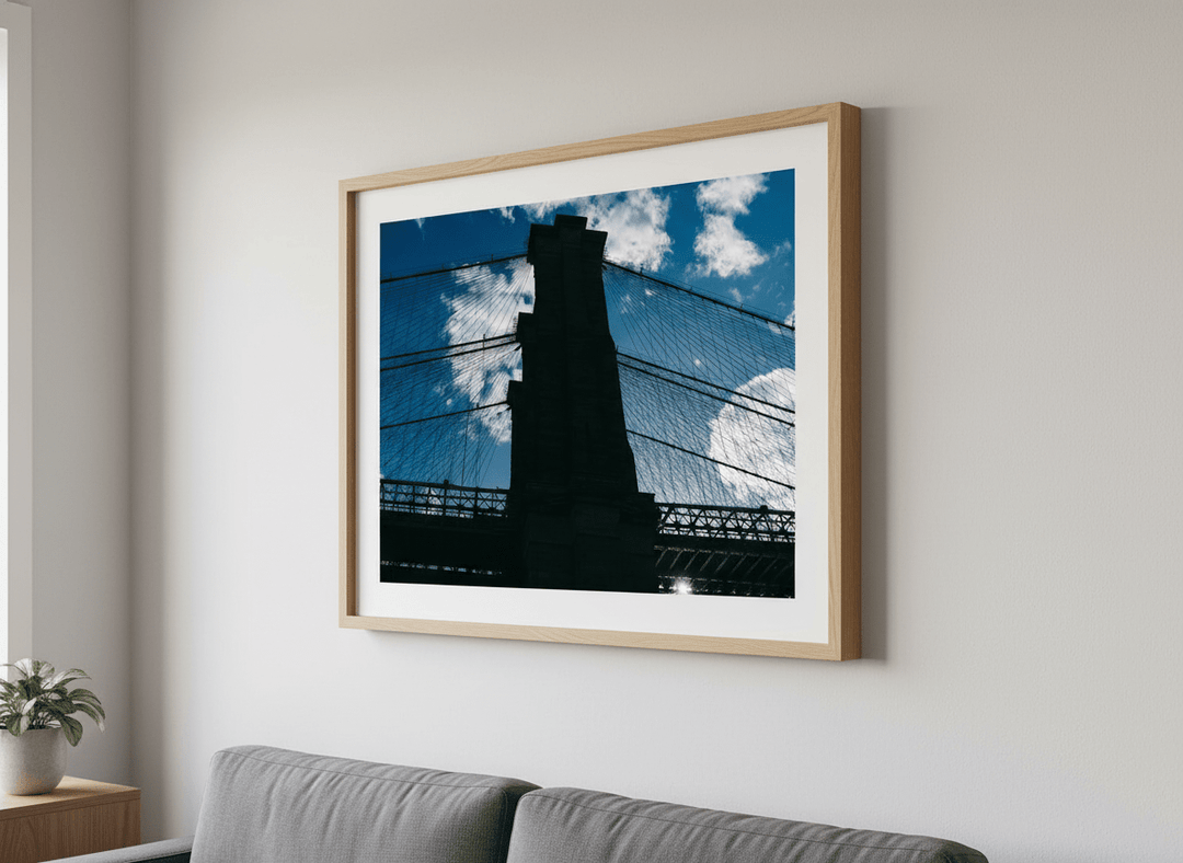 Modern wall art styled above a sofa in a neutral living room
