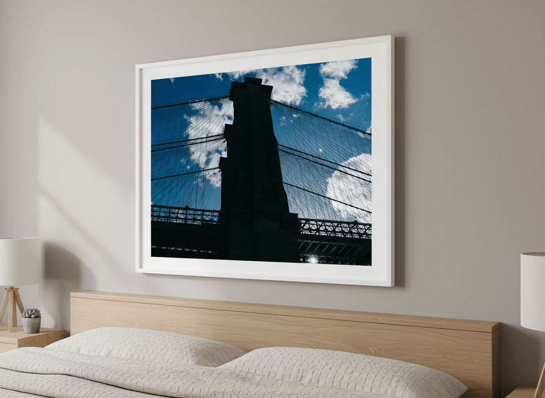 Minimalist artwork displayed in a calm, light-filled bedroom interior