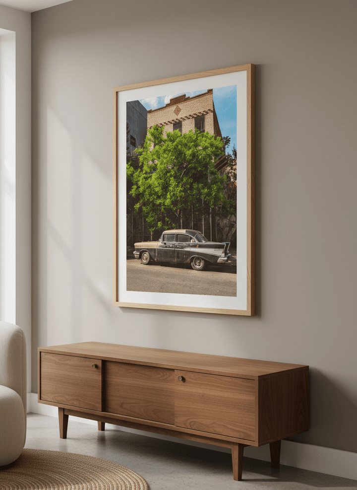 Modern wall art styled above a sofa in a neutral living room
